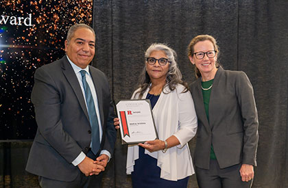 Maria Rivera (center) with Senior Associate Dean Mazen Shehat and Executive Dean Laura Lawson.